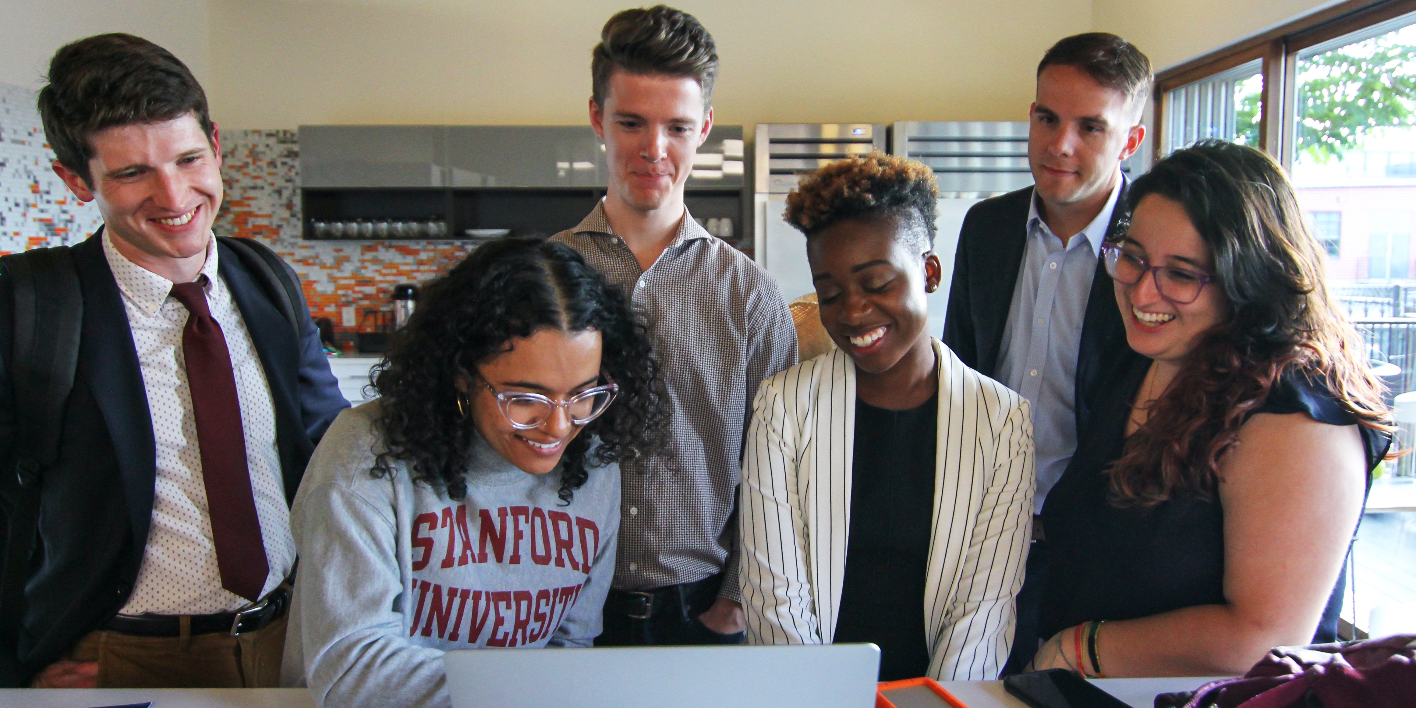 Group of students gathered around a table