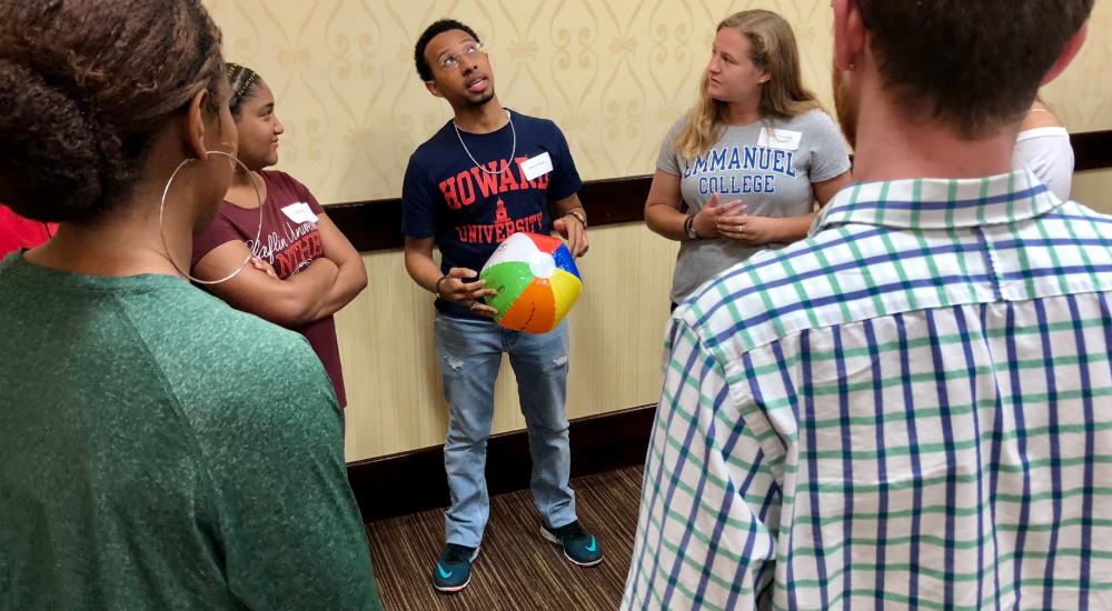 A group of students standing in a circle