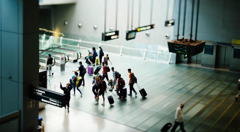 Photo of people walking through an airport