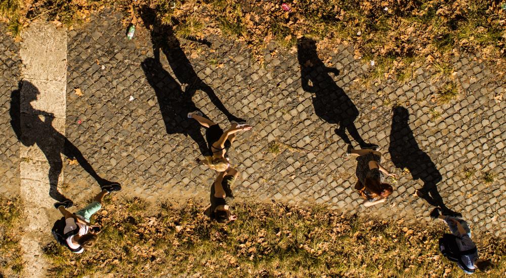 students walking across a campus