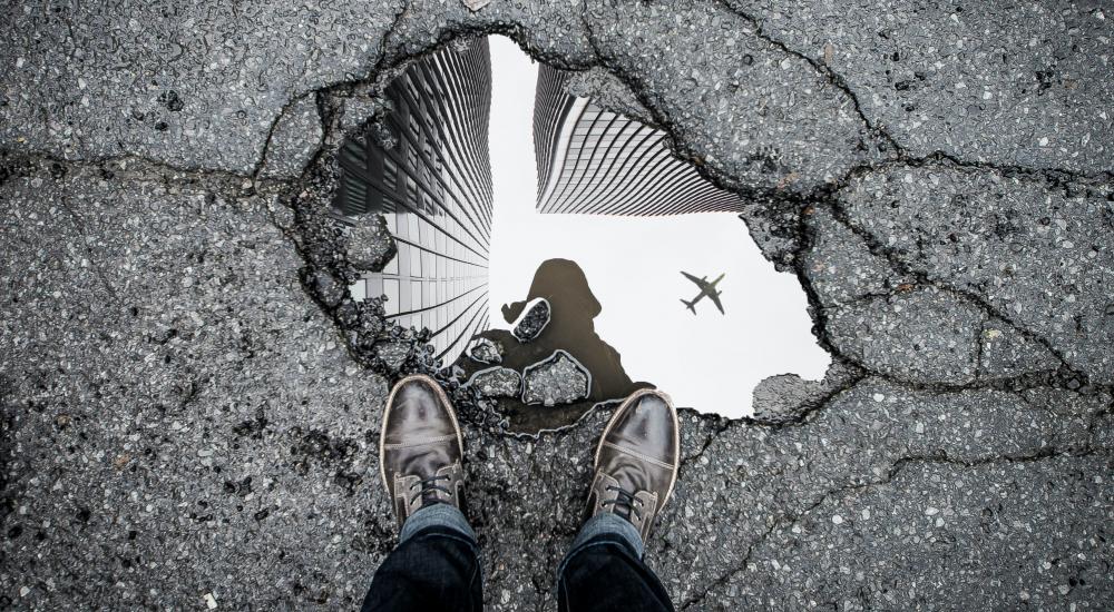 Reflection of a plane in a puddle