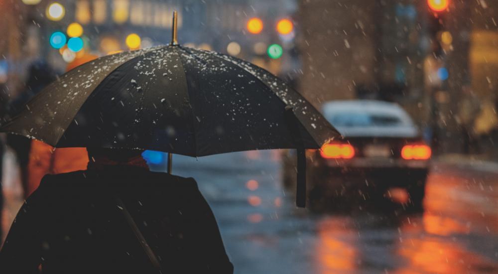 person with an umbrella on a rainy street