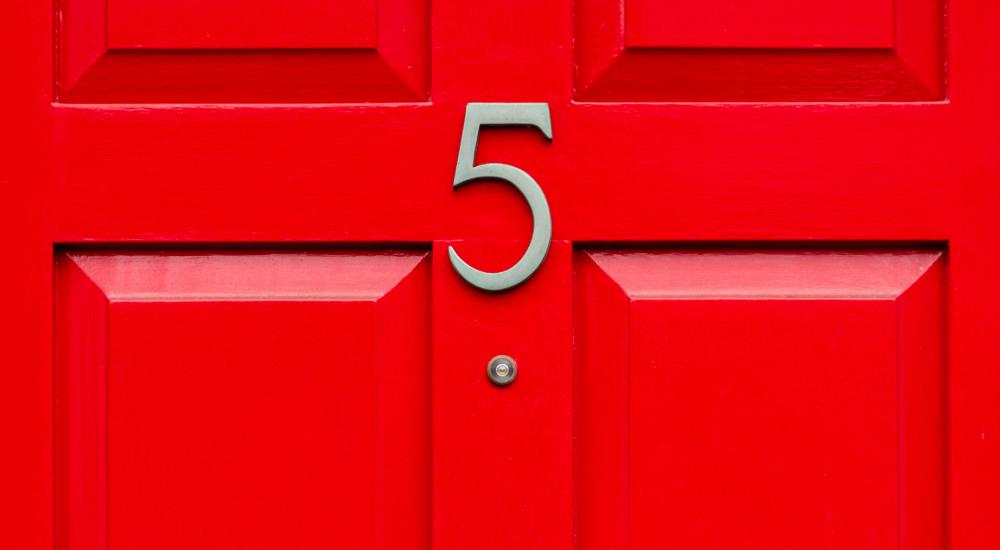 house number 5 on a red door