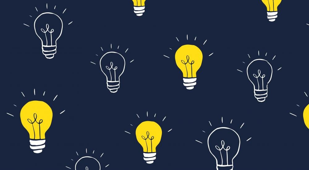 Illustration of yellow and clear lightbulbs on a navy background