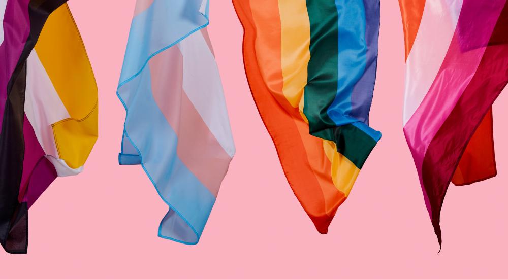 image of several multicolor LGBTQIA flags