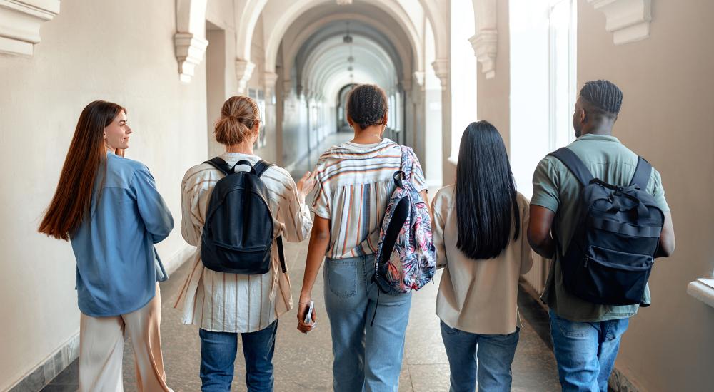 group of students walking down a hallway