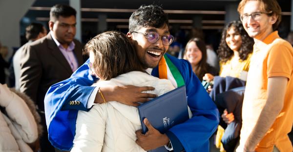 University of Kentucky graduate hugs his mother