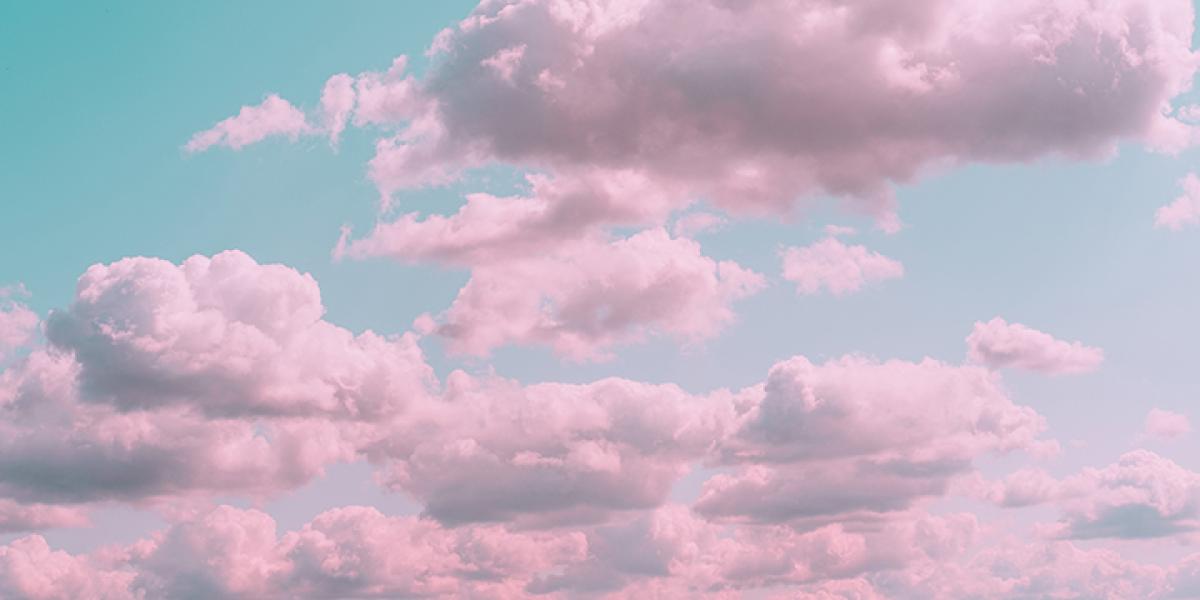 Pink clouds against a blue sky