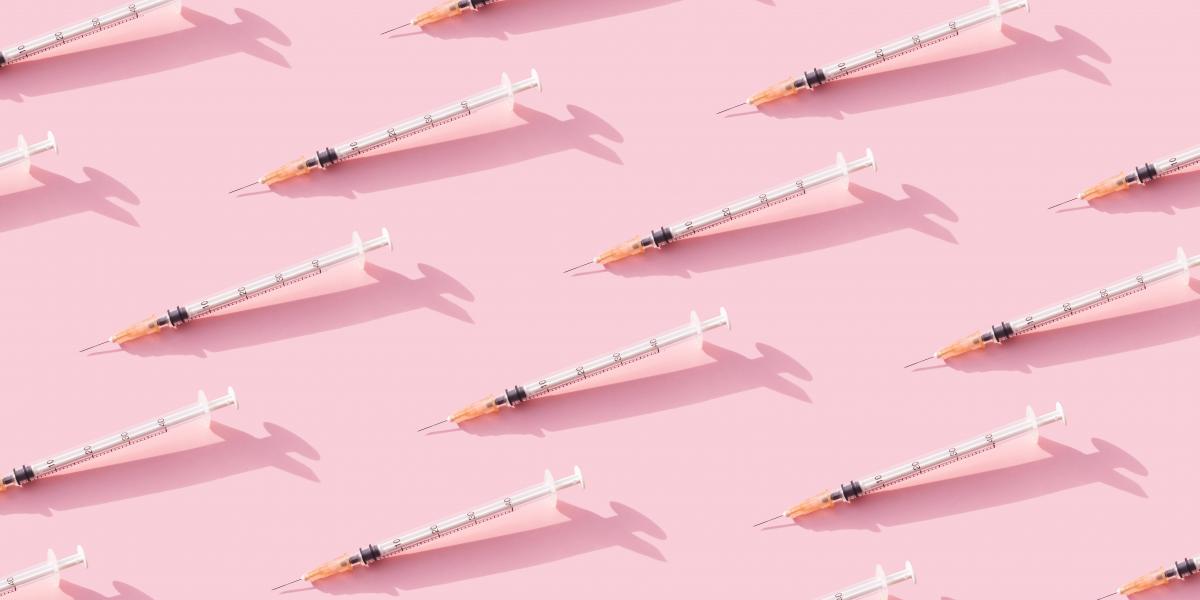 syringes on a pink background