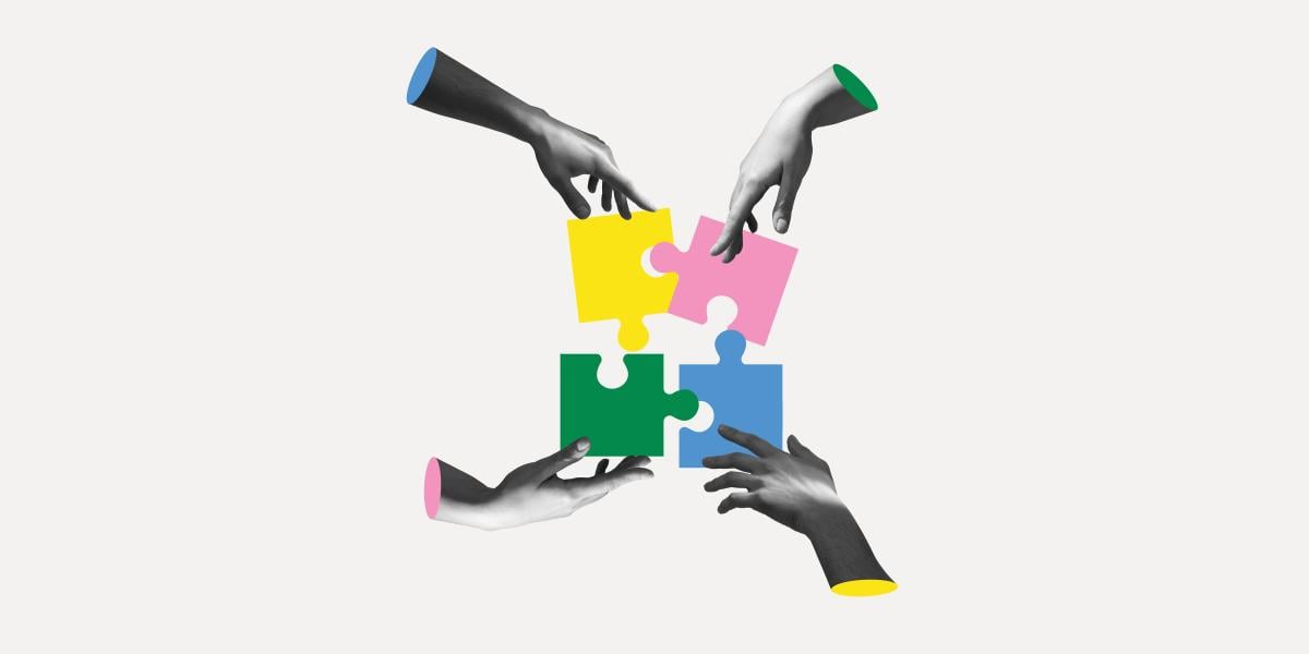 illustration of four hands putting puzzle pieces together