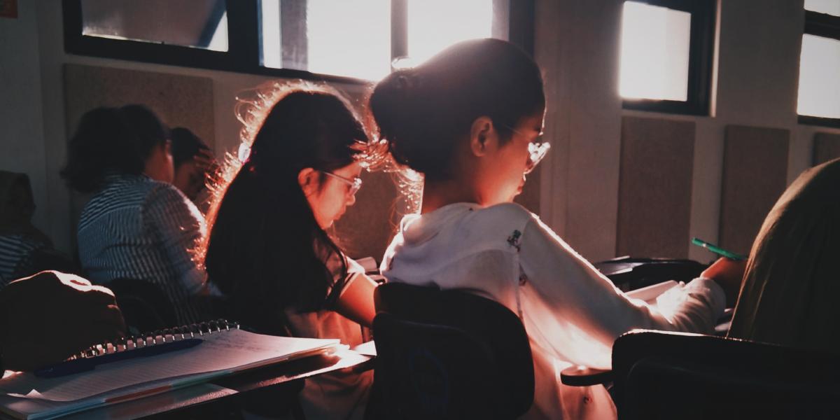 Students sitting at desks in a classroom