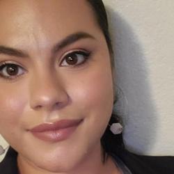 Myrna Najera Perez smiles with earrings on