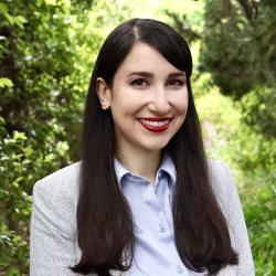 Woman smiling with long dark brown hair