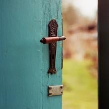 Photo of a blue door opening to the outside