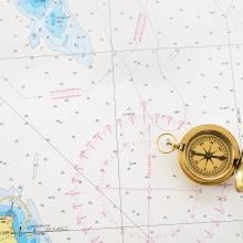 Photo of a compass on a map