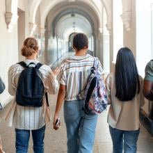 group of students walking down a hallway