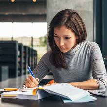 Young woman studying in library