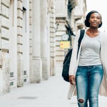 Photo of a student walking down the street